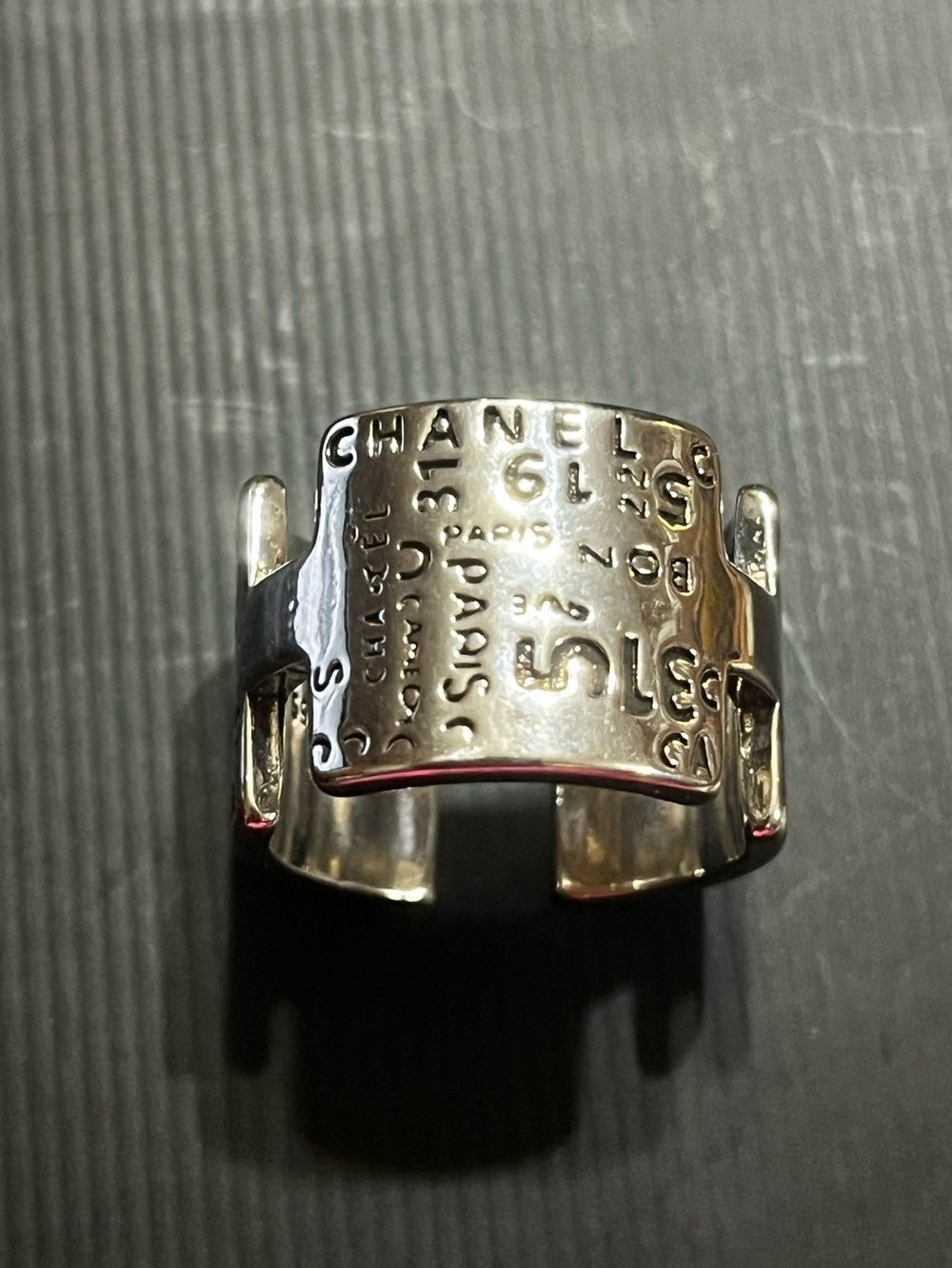CHANEL Silver Cuff Ring with Embossed Logo